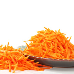 grated carrots on a white plate
