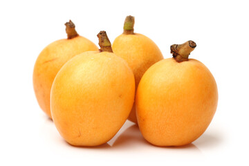 Close up view of some loquat fruit isolated on a white background 