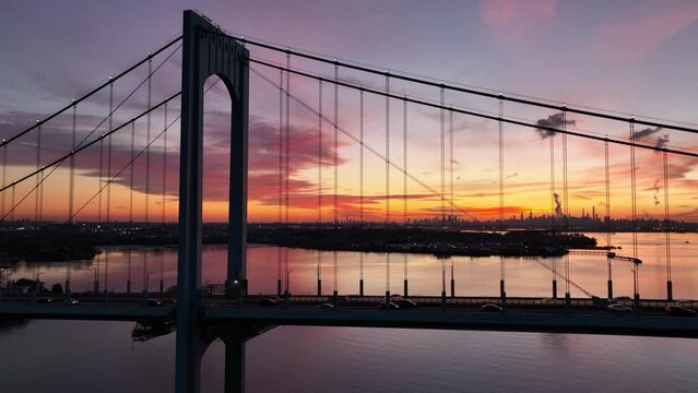still later flying clockwise around Whitestone Bridge with NYC sunset in bkrd