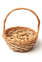 Fototapeta na wymiar basket of peanuts isolated on white