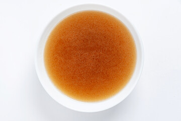 close up of a bowl of chicken broth