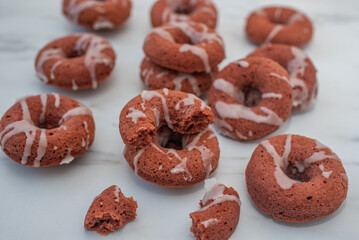 sweet home made red velvet donuts with frosting