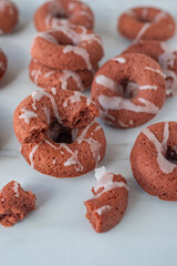 sweet home made red velvet donuts with frosting