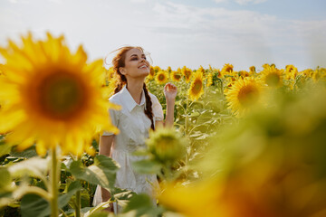 woman with two pigtails in a white dress admires nature unaltered