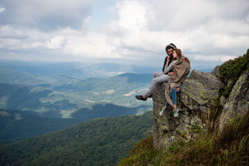 Romantic couple camping on nature background. Adventure for young friends on summer day. Nature trips. Panoramic mountains landscape.