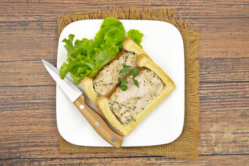 slice of chicken mustard pâté en croute on a plate