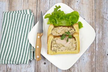 slice of chicken mustard pâté en croute on a plate