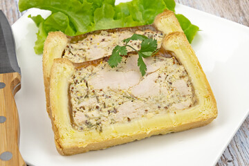 slice of chicken mustard pâté en croute on a plate