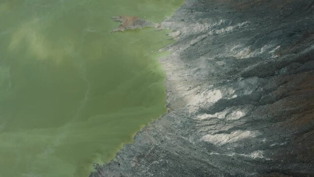 Top View Of Green Lake And Rugged Crater In El Chichonal Volcano, Chiapas, Mexico - aerial drone shot
