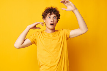 Young curly-haired man Youth style studio casual wear isolated background unaltered