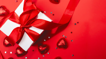 valentines day background. gift box, candy in the form of a red heart