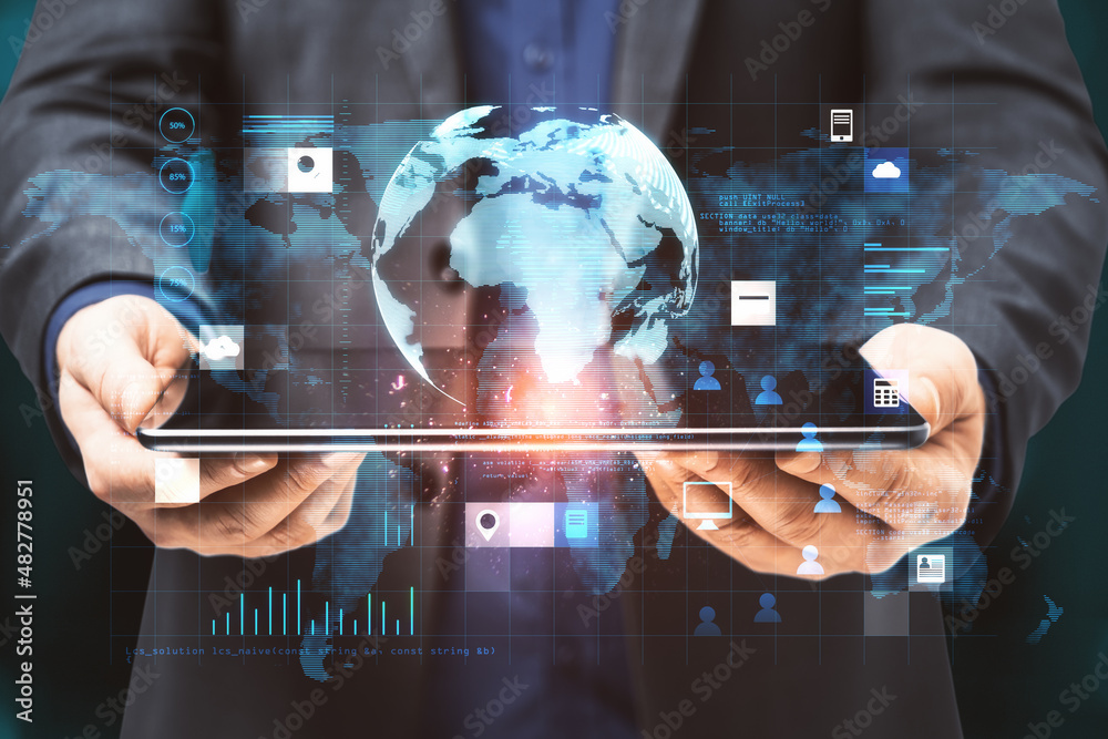 Poster close up of businessman hands holding tablet with creative glowing globe hologram grid interface on 