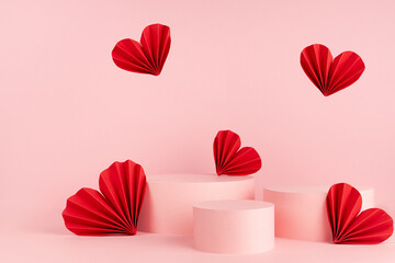 Valentines day pink stage mockup with set of three different circle podiums, red love paper hearts...