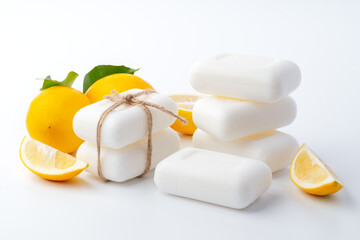 Fototapeta na wymiar Handmade soap bars and lemon on white background.