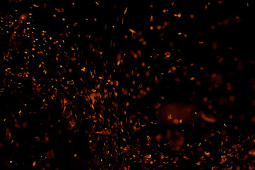 Fototapeta na wymiar flame fire with sparks on black background