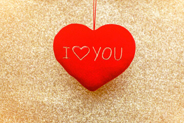 Heart symbol on a gold shiny background