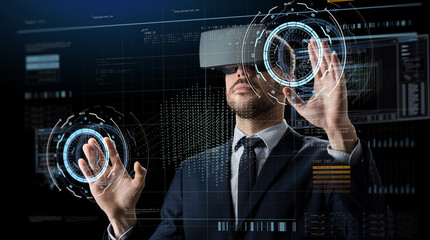 business, augmented reality and modern technology concept - businessman in vr glasses working with virtual screen hologram over black background