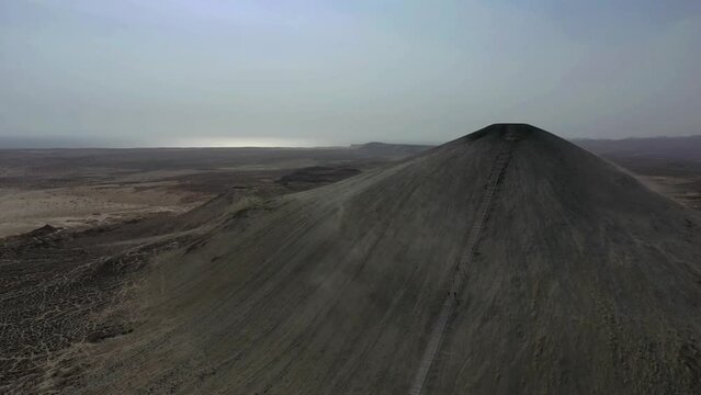 Aerial View Of Stairs Leading To Chandragup Mud Volcano. Dolly Forward