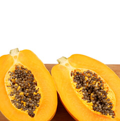 Papaya fruit sliced on half isolated on a white background.