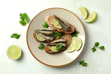 Concept of tasty snack with sandwiches with sprats