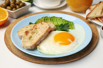 Concept of tasty breakfast on white background