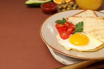 Concept of tasty breakfast on brown background