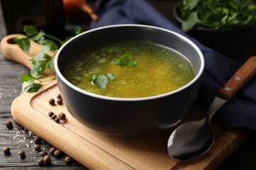 Concept of tasty food with chicken soup on wooden background