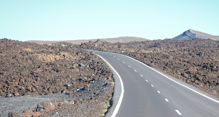 Empty road toward a volcano in Lanzarote