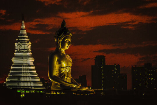 Big Buddha located in the middle of the community against evening in Bangkok, Thailand.