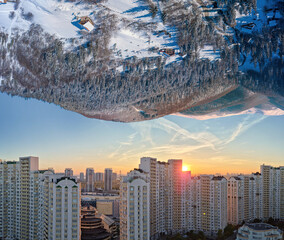 Nature versus city. Beautiful mountain landscape from one side and city laldscape from other. Conceptual picture of relationships between cities and nature. 