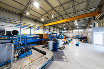 Photo shot of rolls of steel sheet stored in warehouse; Cold rolled steel coils at the factory. Engineering production