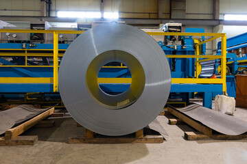 Metal tile for roof in metallic forming machine production line in factory. Cold rolled steel coils at the plant