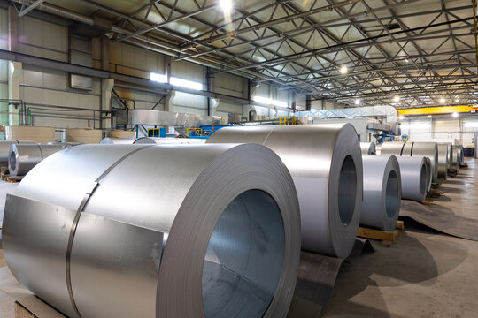 Metal tile for roof in metallic forming machine production line in factory. Cold rolled steel coils at the plant. Industrial concept