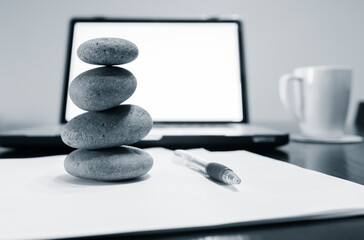 stack of stones on a office  table, work life balance 