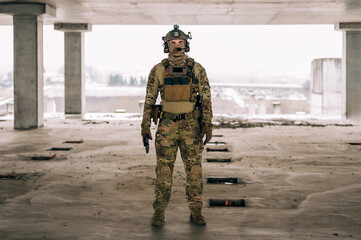 Special forces operator wearing Multicam uniform and his handgun xdm 9mm while practicing CQB...