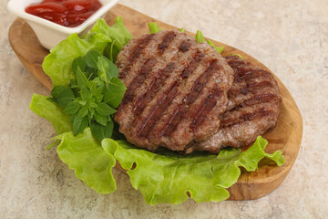 Grilled beef burger cutlet with sauce