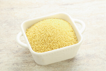 Raw couscous in the bowl