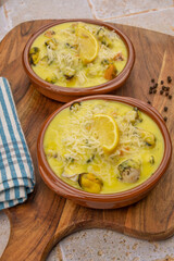 scallop gratin and mold on a wooden board