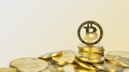 Bitcoin cryptocurrency standing on pile of gold crypto coins with copy space.