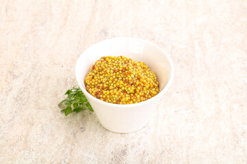 Grain mustard sauce in the bowl