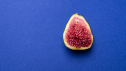 a ripe fig fruit cut in half