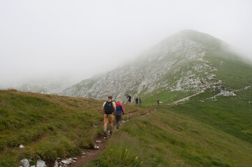 Fototapeta na wymiar Hiking in the Clouds. Bergamo, Italy