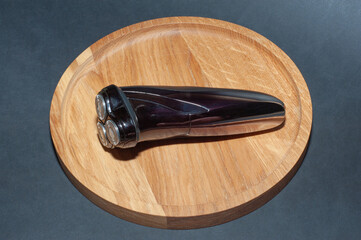 Electric shaver for man on table wood