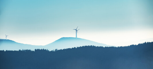 Black Forest background - Amazing blue foggy fog panorama landscape with silhouette from forest...