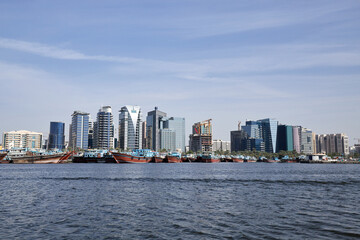 Fototapeta na wymiar View of the city of Dubai from a boat in the old Abra port, UAE