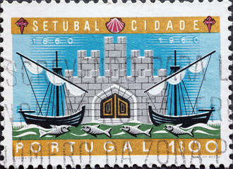 Portugal - circa 1961: a postage stamp from Portugal, showing a.two sailing ships and a castle....