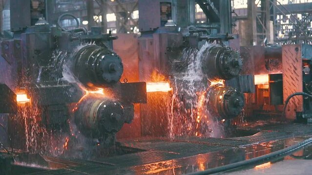 Metal production process in a metallurgical factory. Red hot metal in a modern factory. Modern metallurgical factory