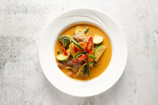 Red curry dish on table
