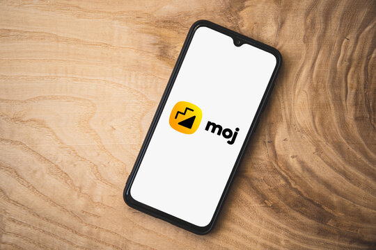 Moj application on smartphone. Top angle shot. Moj is an Indian video-sharing social networking service