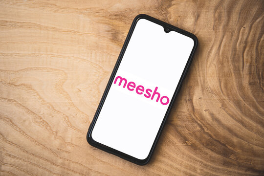 Meesho application on smartphone. Top angle shot. Meesho is an indian social e-commerce company